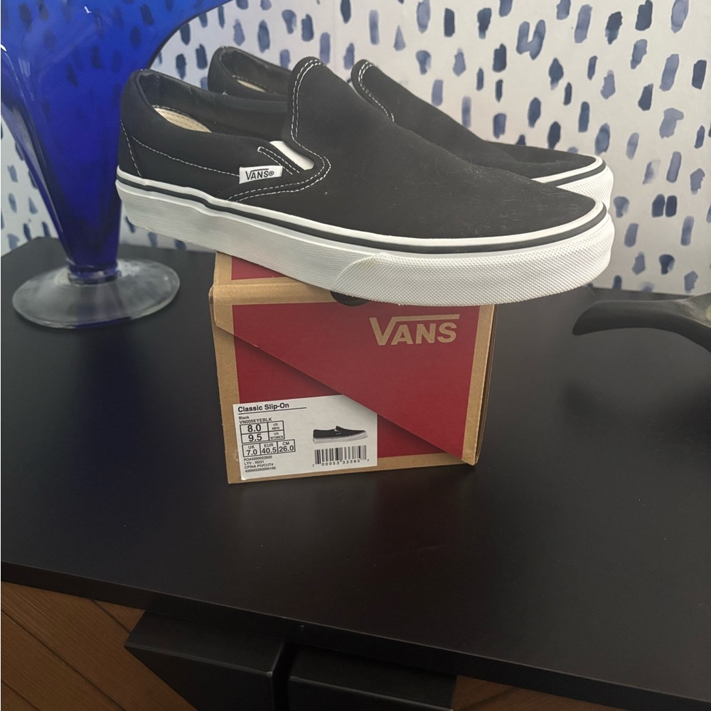 Unisex Vans Black and White Slip-On Sneakers, women’s 9.5, men’s 8